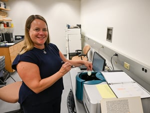 Sarah Sobeck, professor of chemistry, studies light-emitting pigments in her lab at The College of Wooster.