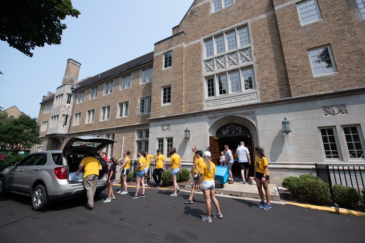 Students moving into a residence hall