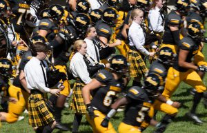 Bagpipers leading football team