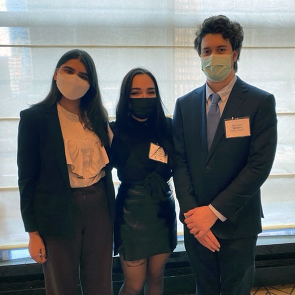 photo of 3 students wearing business attire and representing The College of Wooster at the American Model UN Conference in Chicago