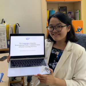 Photo of Hannah Nguyen holding her laptop