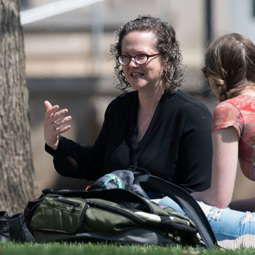 Professor of Women's, Gender, and Sexuality Studies Christa Craven teaches class outside at The College of Wooster.