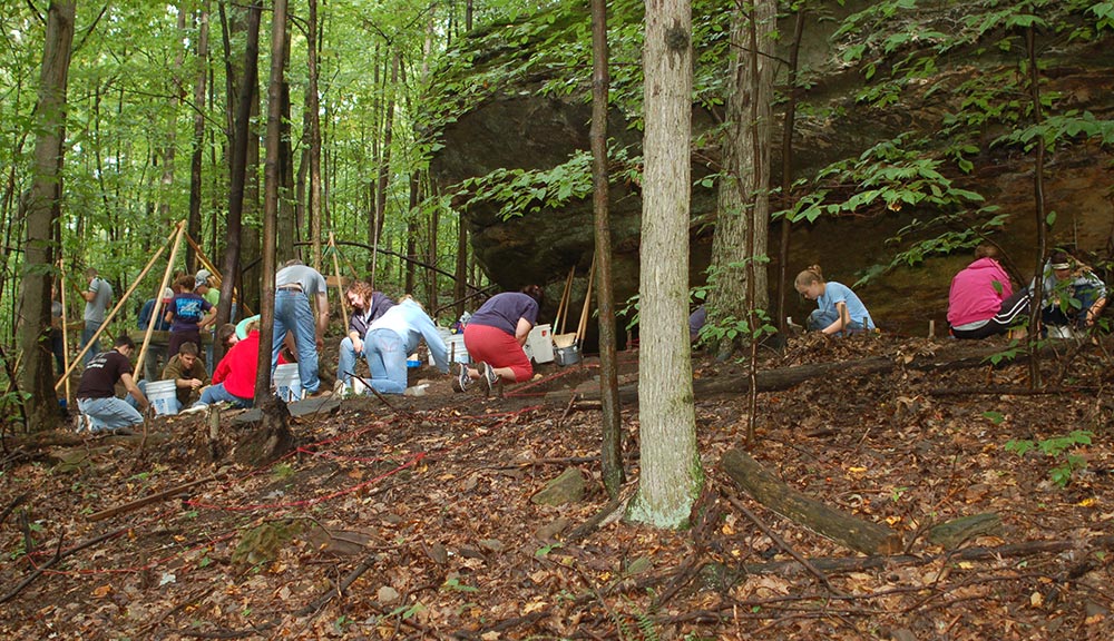 Wooster students work on site at the Meade Rock Shelter near Glenmont in Holmes County in 2008, alongside Ashland University Students. Photo provided by Professor Brush.