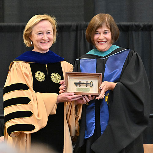 President McCall was presented with the key to Old Main at inauguration as a symbol of her authority and the continuity of Wooster’s mission and heritage.