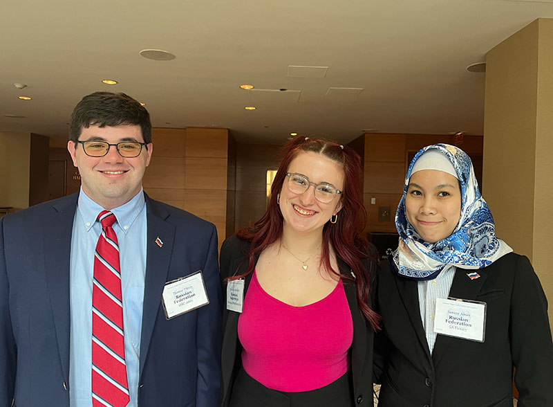 Caption 2: Carrie Buckwalter ’24, the 2023-24 Model UN president and the team’s head delegate for the conference, stands alongside, Thomas Pitney, vice president, and Sammy Amier research director.