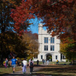 College of Wooster campus in the fall with students in front of Kauke