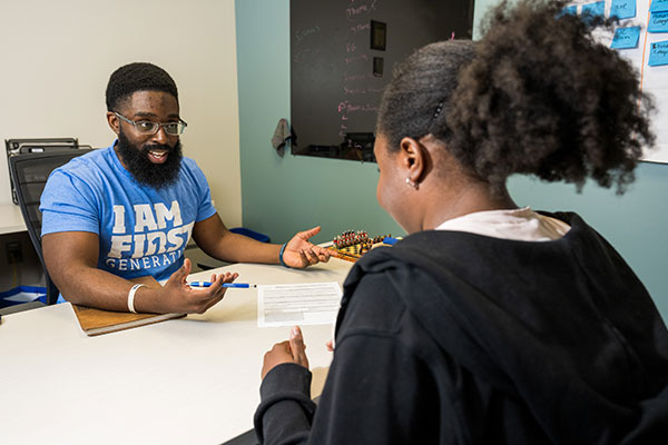 Peter Jeffy '14 advises a student