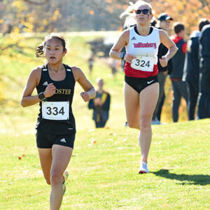 Isabelle Hoover '23 competing in a cross country meet.