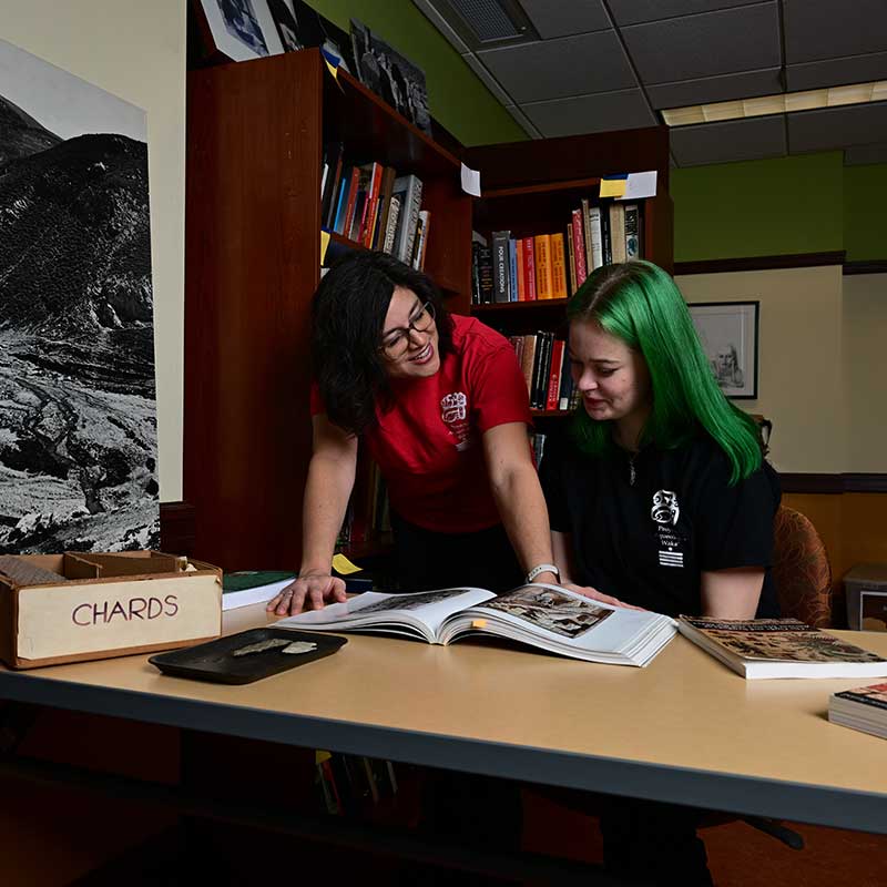 Professor Olivia Navarro-Farr mentors a senior archaeology student as she completes research for her Independent Study.