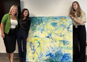 Kugler '27 showcases her artwork alongside fellow colleagues at the Reentry Services Division of the Federal Bureau of Prisons. Photo provided by subject.