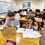 Wooster students, Acharya (left) and Haar (right) take their turn in the computer lab; only two teammates are allowed at a time in the lab, which increases the challenge and requires concentrated collaboration.