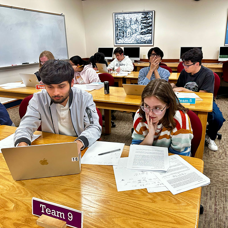 Wooster students, Acharya (left) and Haar (right) take their turn in the computer lab; only two teammates are allowed at a time in the lab, which increases the challenge and requires concentrated collaboration.