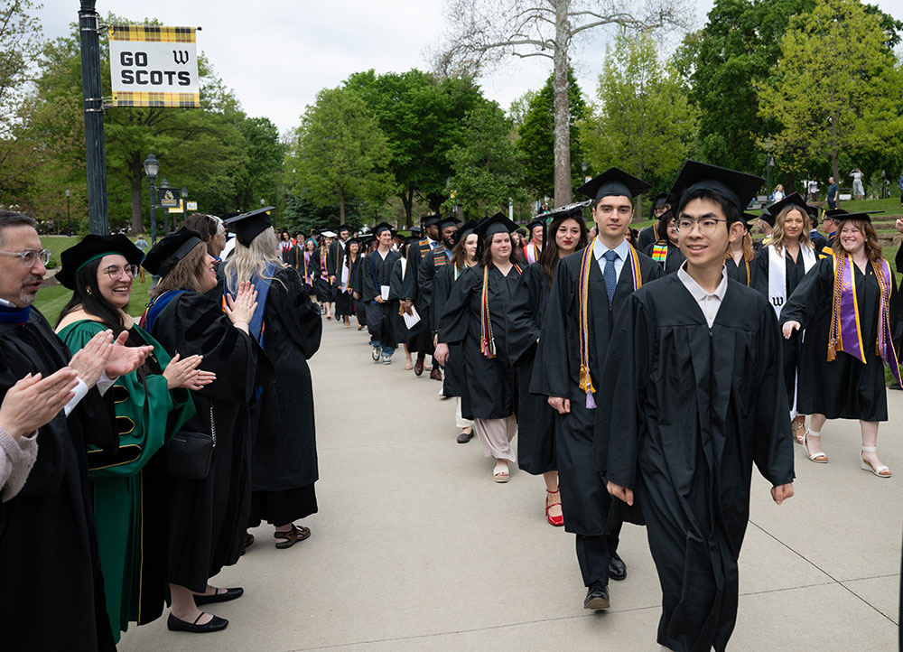 The Class of 2026 marched from Kauke Arch to Scot Center greeted by the faculty.
