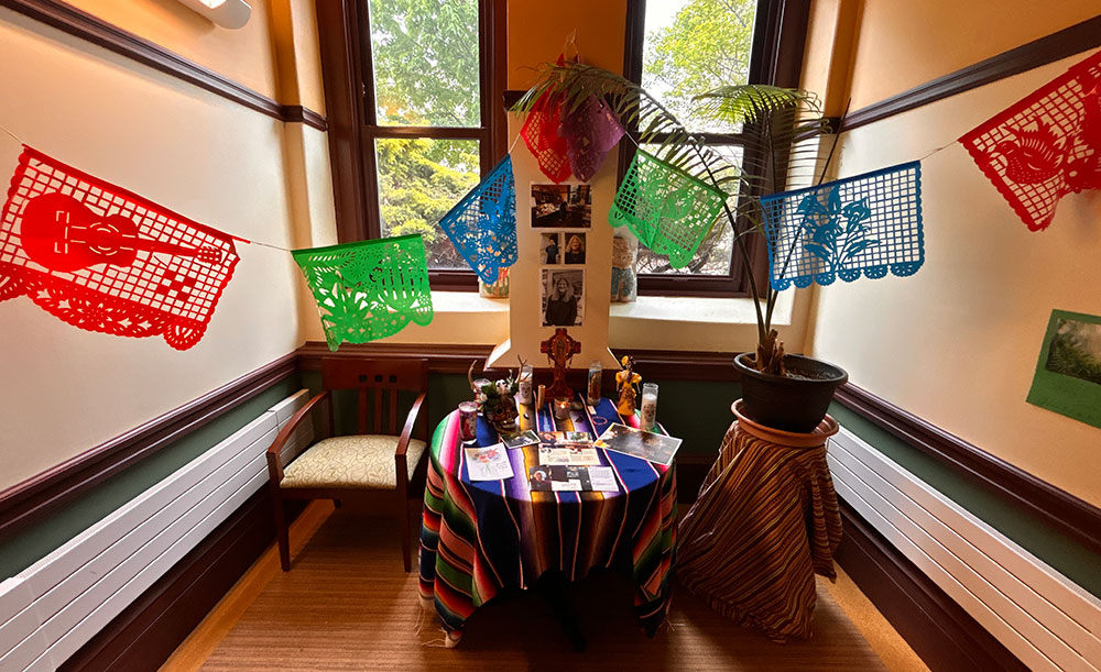 Members of the community honored Pam Frese, who started a tradition to celebrate the Day of the Dead on campus as part of her Contemporary U.S. Culture and People and Cultures of Latin America class, with an altar near her office honoring her legacy.